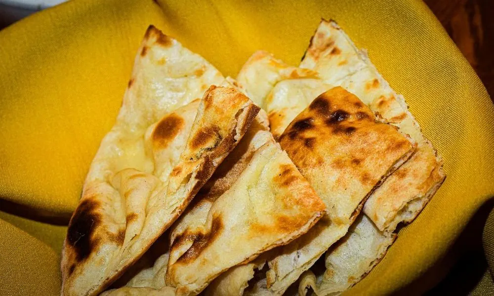 Naan Levitating flatbread with charred spots at Lahana Indian Cuisine, a Authentic Indian Cuisine Restaurant restaurant in New York