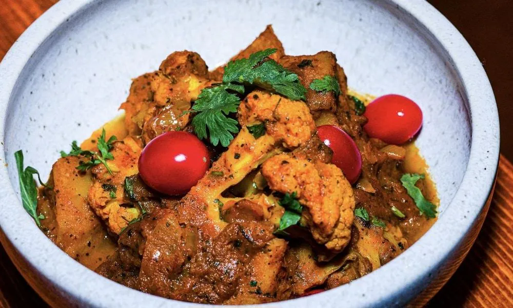Chicken Curry Spicy chicken curry with cauliflower and cherry tomatoes at Lahana Indian Cuisine, a Authentic Indian Cuisine Restaurant restaurant in New York