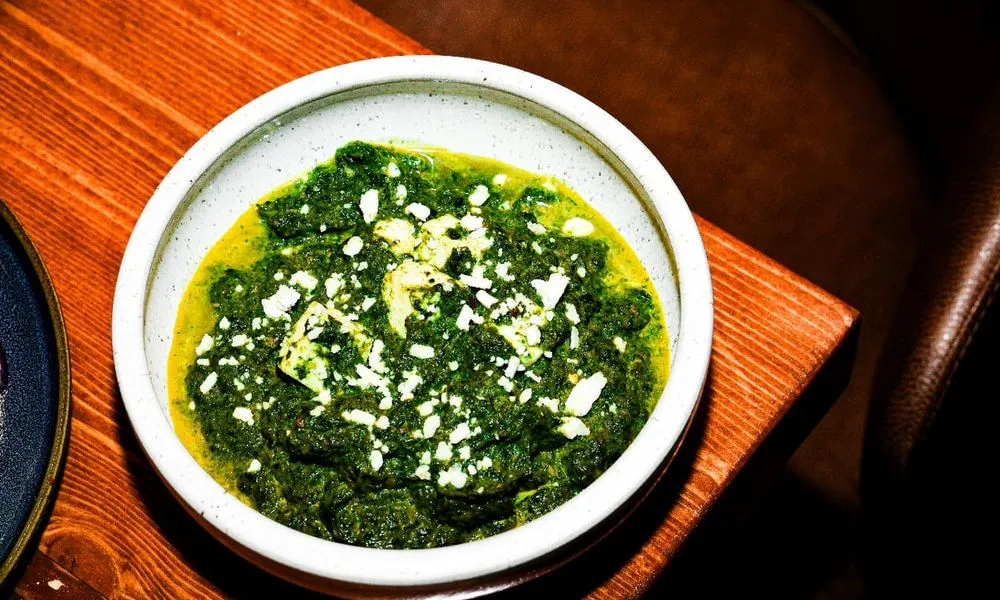 Spinach and Cheese Green spinach dish topped with white cheese at Lahana Indian Cuisine, a Authentic Indian Cuisine Restaurant restaurant in New York