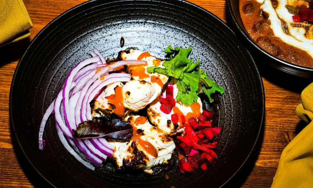 Grilled Chicken Salad Grilled chicken with red onion, beetroot, and greens at Lahana Indian Cuisine, a Authentic Indian Cuisine Restaurant restaurant in New York