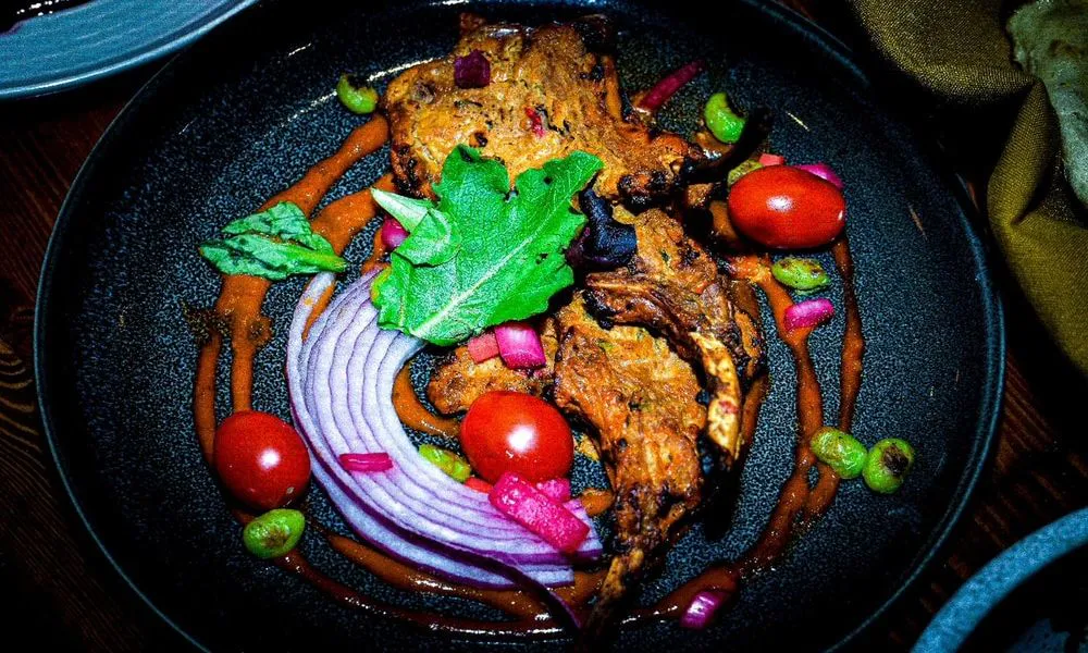 Grilled Fish Grilled fish with cherry tomatoes and red onion at Lahana Indian Cuisine, a Authentic Indian Cuisine Restaurant restaurant in New York